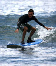 Michael Cheney surfing in Hawaii